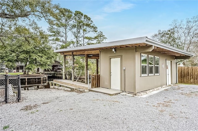 back of property with fence