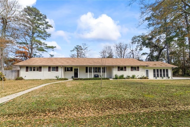 ranch-style home with a front lawn