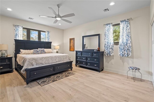 bedroom featuring light hardwood / wood-style floors and ceiling fan