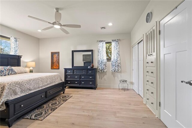 bedroom featuring light hardwood / wood-style floors and ceiling fan