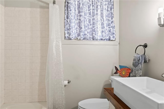 bathroom featuring sink and toilet