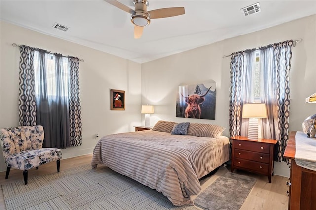 bedroom featuring ceiling fan and light wood-type flooring