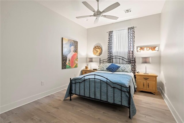 bedroom featuring light hardwood / wood-style floors and ceiling fan