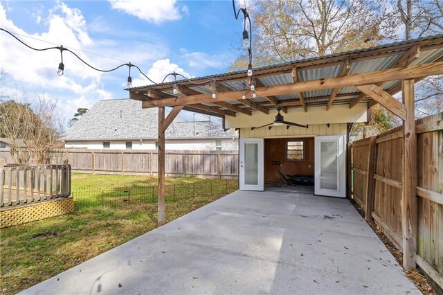 view of patio featuring ceiling fan