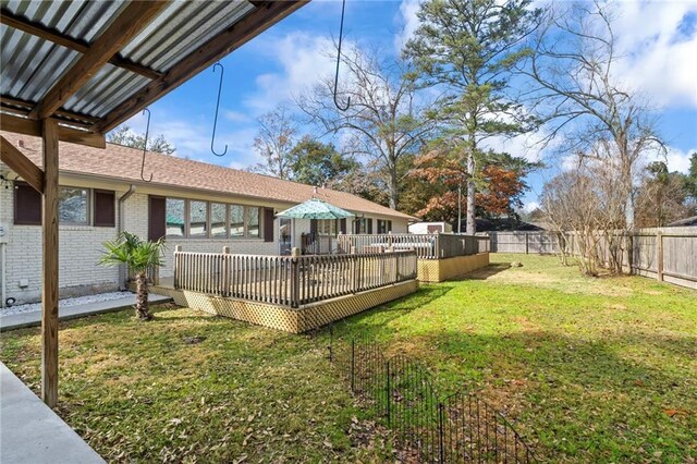 view of yard with a deck