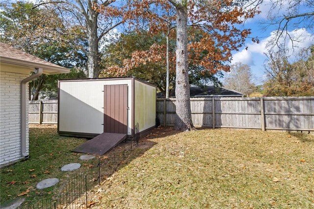 view of outdoor structure featuring a lawn