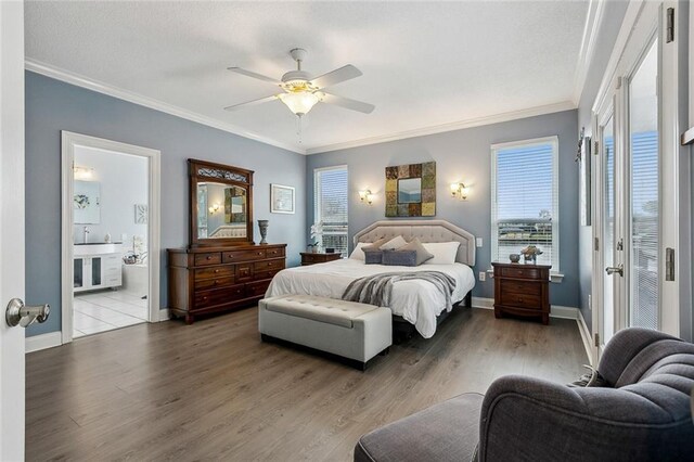 bedroom featuring crown molding, ceiling fan, hardwood / wood-style floors, and ensuite bath