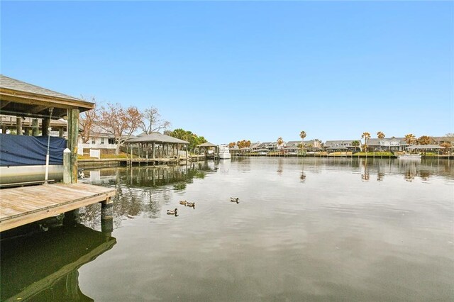 dock area featuring a water view