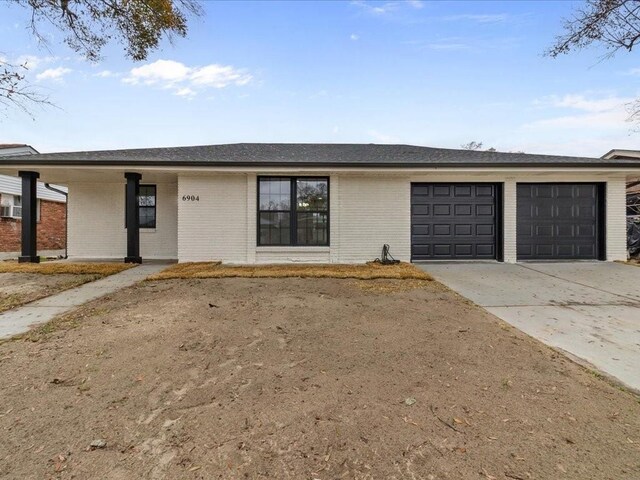 ranch-style home with a garage