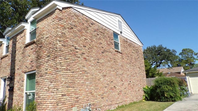 view of side of property with a garage