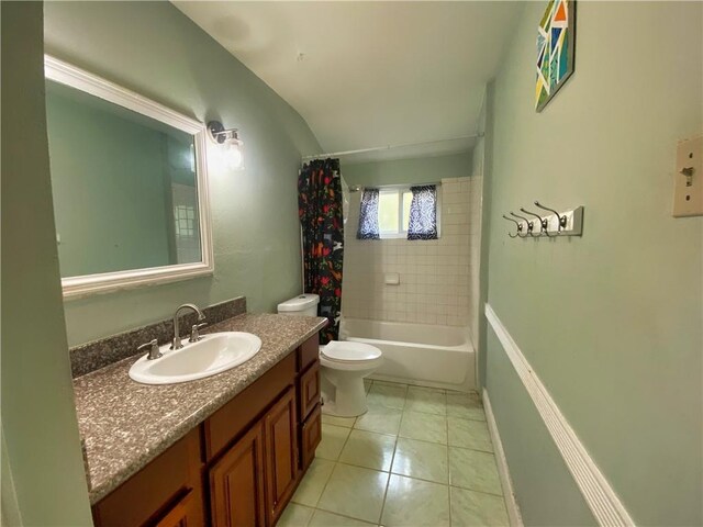 full bathroom with tile patterned flooring, shower / bath combo, vanity, and toilet