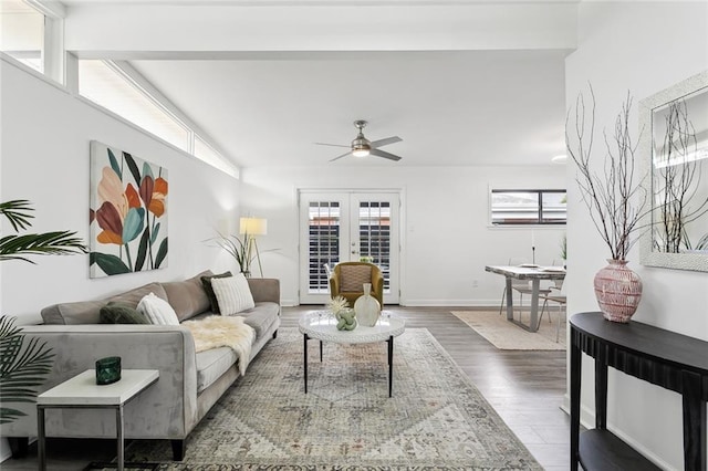 living room featuring dark wood-type flooring, ceiling fan, and french doors