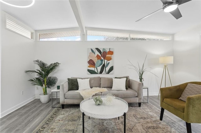 living room with lofted ceiling with beams, wood-type flooring, and ceiling fan