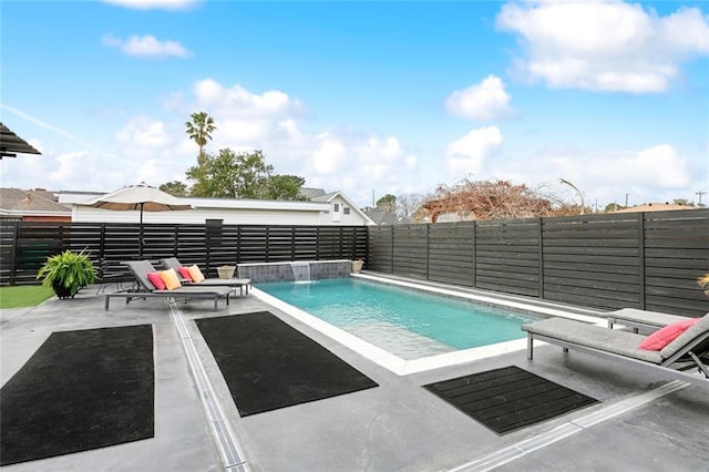 view of pool with pool water feature and a patio area