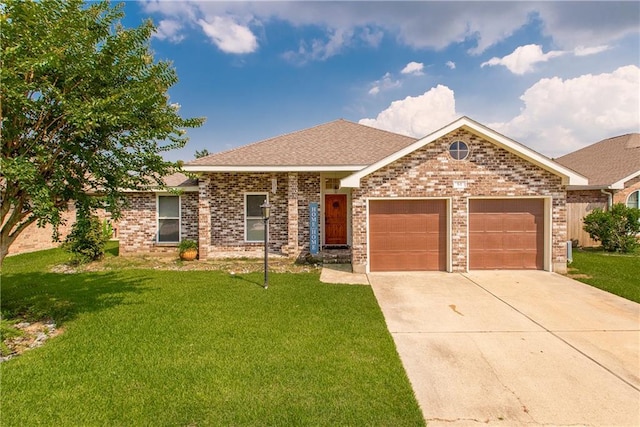 single story home featuring a garage and a front lawn