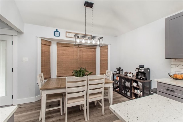 dining area featuring wood-type flooring