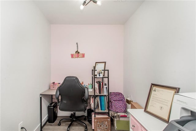 office with light hardwood / wood-style flooring