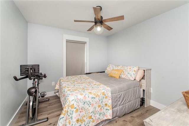 bedroom with ceiling fan and light hardwood / wood-style floors