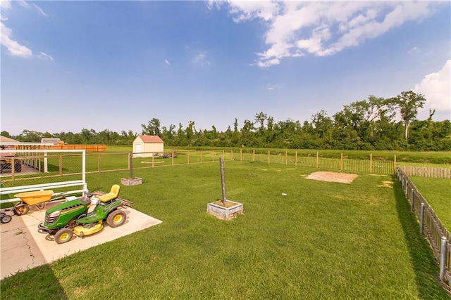 view of yard with a rural view