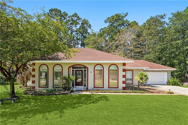 30302 Ashley Dr, Lacombe, LA 70445 - view of front of home with a front lawn, stucco siding, a garage, and concrete driveway