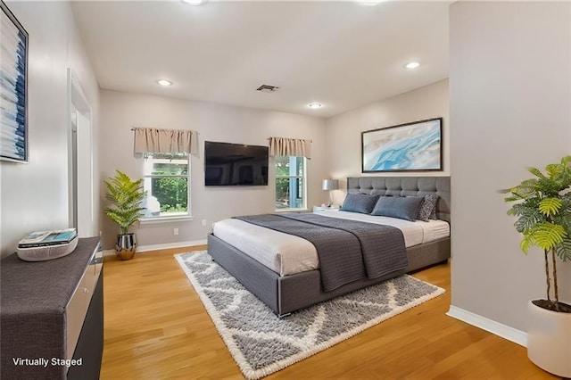 30302 Ashley Dr, Lacombe, LA 70445 - bedroom featuring visible vents, baseboards, recessed lighting, and light wood-style floors