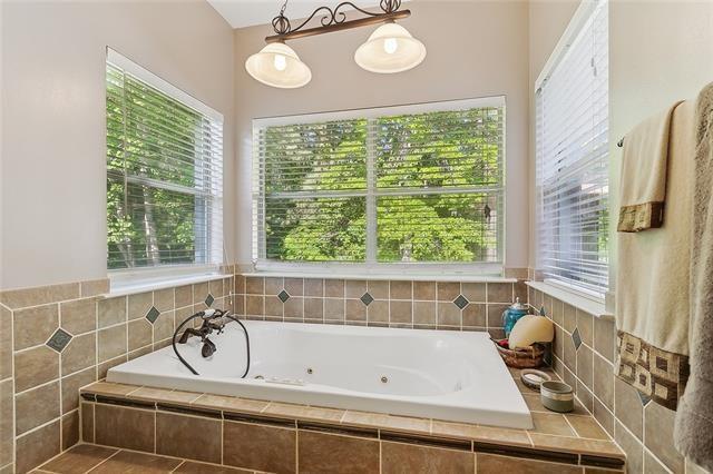 30302 Ashley Dr, Lacombe, LA 70445 - full bathroom featuring a tub with jets
