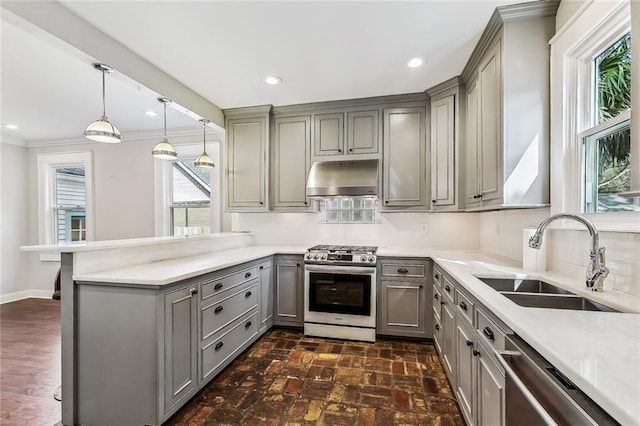 kitchen with sink, stainless steel range with gas stovetop, dishwashing machine, kitchen peninsula, and range hood