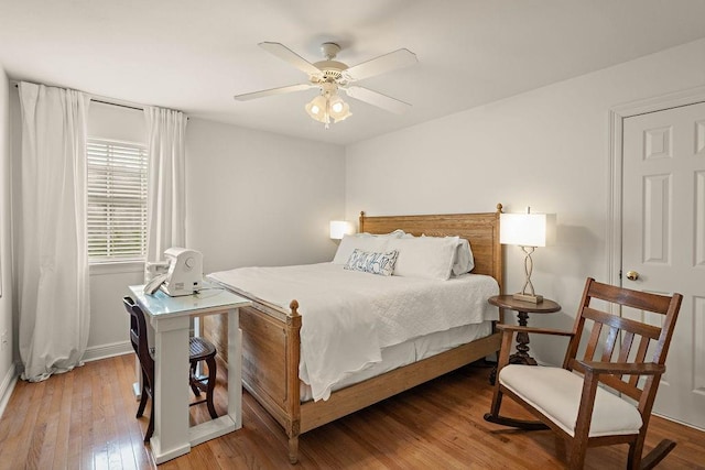 bedroom featuring ceiling fan and light hardwood / wood-style flooring