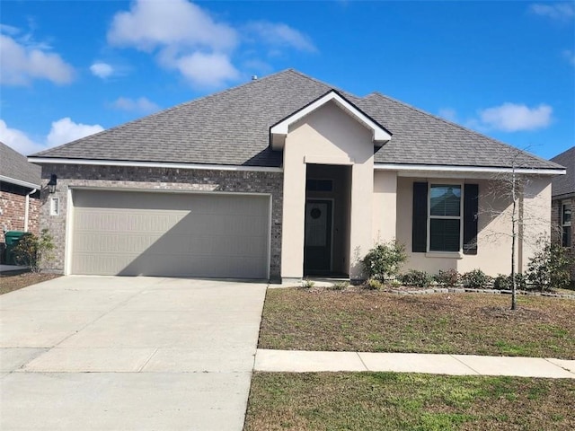 5574 Grand Springs Rd, Slidell, LA 70461 - ranch-style house featuring an attached garage, concrete driveway, a shingled roof, and stucco siding