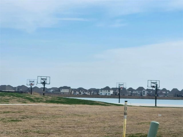 5574 Grand Springs Rd, Slidell, LA 70461 - view of sport court with a residential view, community basketball court, and a lawn