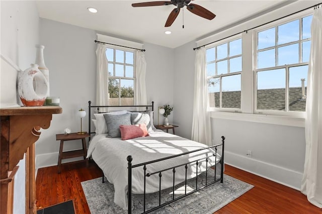 bedroom with dark wood-type flooring