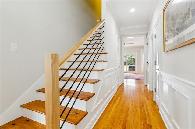 interior space featuring crown molding and hardwood / wood-style floors