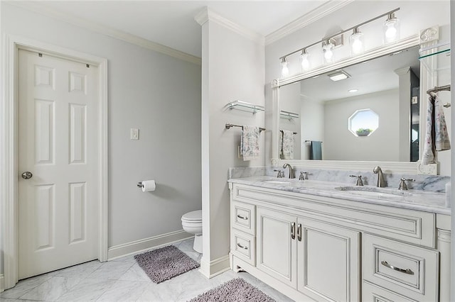 bathroom with ornamental molding, toilet, and vanity