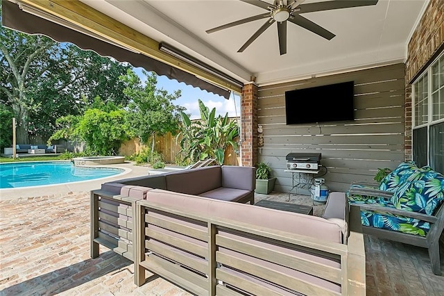 view of patio / terrace featuring a swimming pool with hot tub and outdoor lounge area