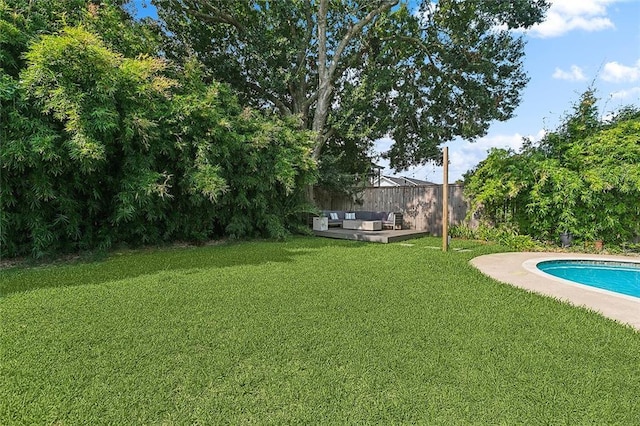 view of yard with a fenced in pool