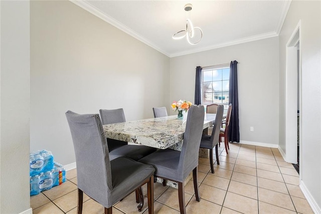 tiled dining area featuring crown molding and a chandelier