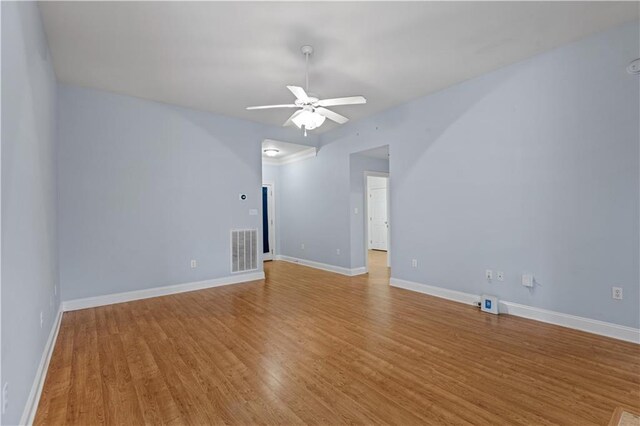 unfurnished room featuring ceiling fan and light hardwood / wood-style flooring