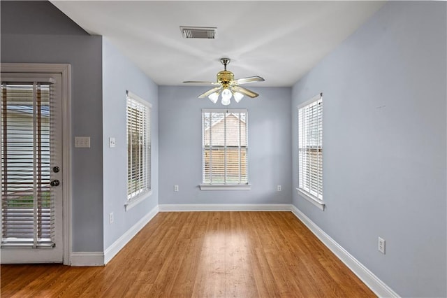 spare room with ceiling fan and light hardwood / wood-style floors