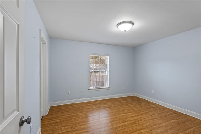 spare room featuring light hardwood / wood-style floors