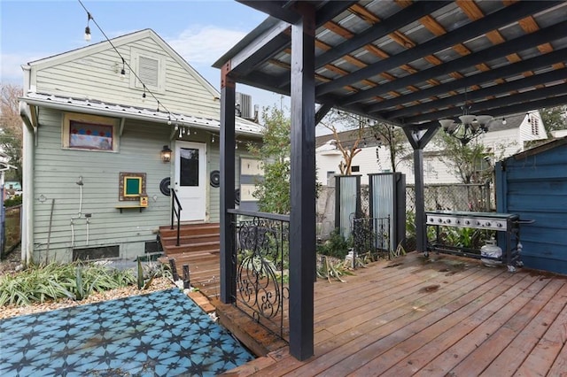 wooden terrace featuring a grill