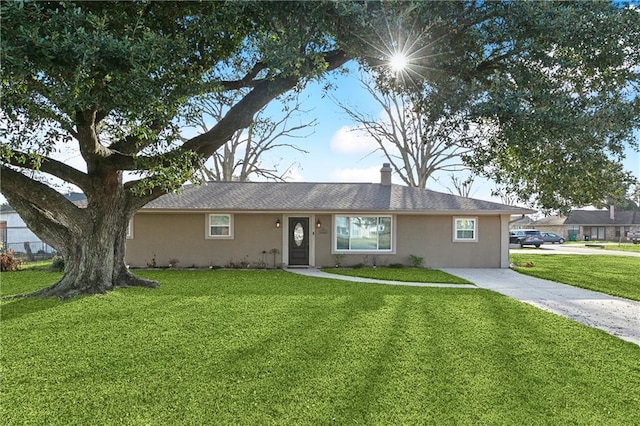 ranch-style house with a front lawn