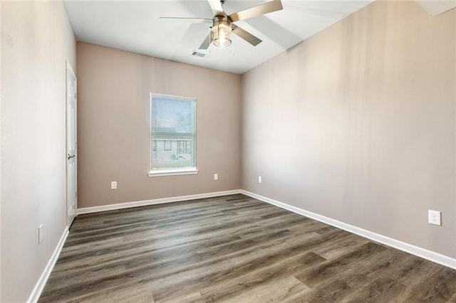 unfurnished room featuring ceiling fan and dark hardwood / wood-style flooring