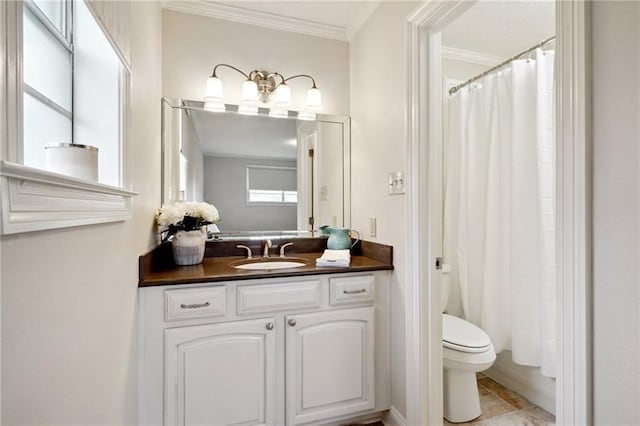 bathroom featuring crown molding, vanity, and toilet