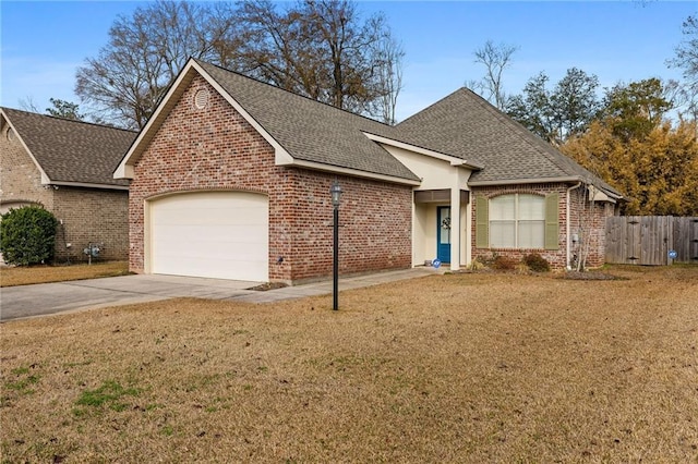 view of front of home with a garage and a front lawn