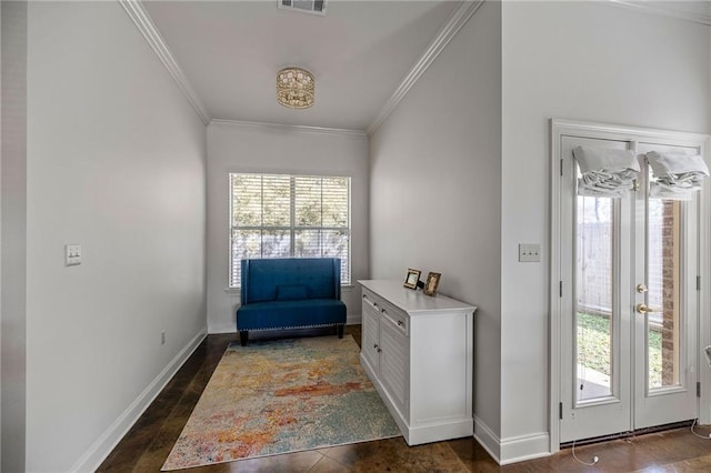 foyer entrance featuring ornamental molding and dark hardwood / wood-style flooring