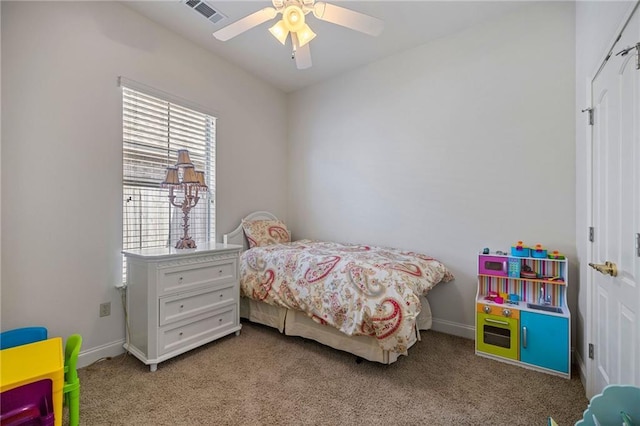 bedroom featuring ceiling fan and light carpet