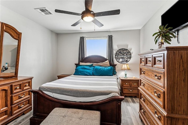 bedroom with ceiling fan and light wood-type flooring