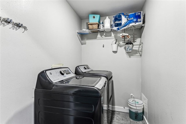 laundry room with separate washer and dryer