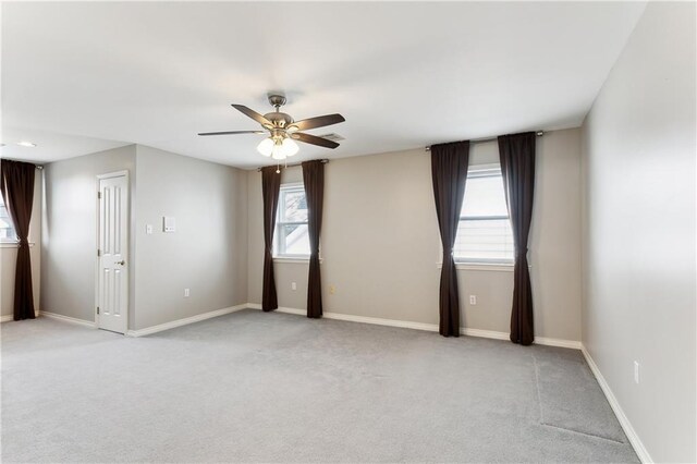 carpeted empty room with ceiling fan