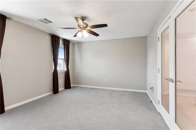 carpeted empty room with ceiling fan